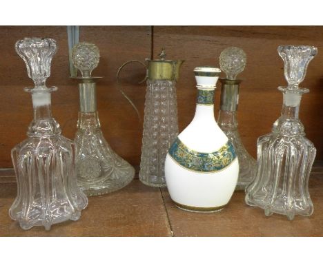 A pair of ship's decanters, a Royal Doulton Carlyle water flask, a pair of decanters and a plated ewer
