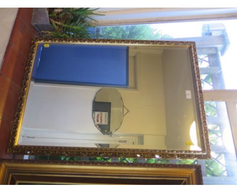 A giltwood framed rectangular wall mirror, with bevelled plate, 57cm x 82.5 cm