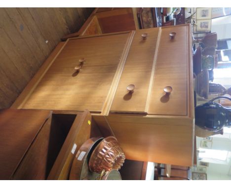 An 1950s oak dressing table and side cabinet by Meredew Furniture, the dressing table with long mirror and two drawers, 116cm