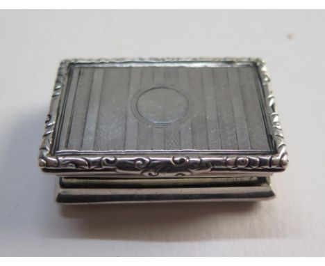 A Victorian silver vinaigrette with engine turned decoration and gilding to the interior 