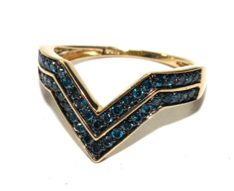 A 9 carat gold ring, set with blue diamonds 