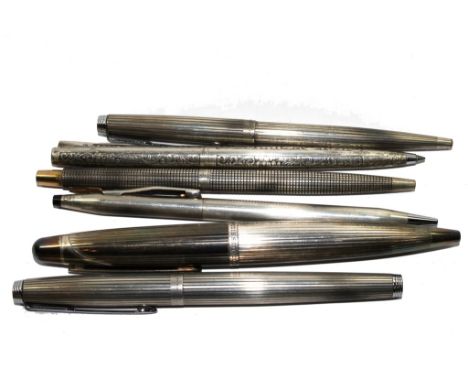 An Alfred Dunhill silver pen, three silver pencils and a silvered metal pencil and Cross pencil (6) 