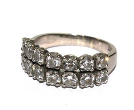 An 18 carat white gold ring, set with fourteen diamonds 