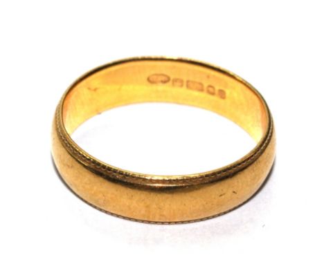 A gold wedding ring, marked 916 