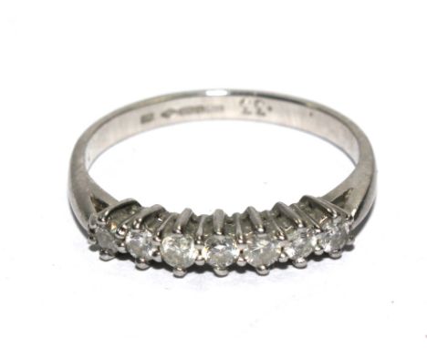 A 18 carat white gold ring set with seven diamonds 