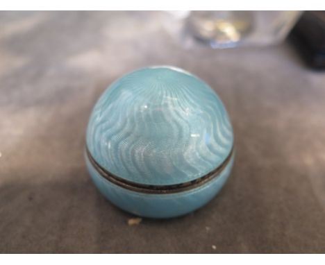 A blue enamel on silver gilt pill box