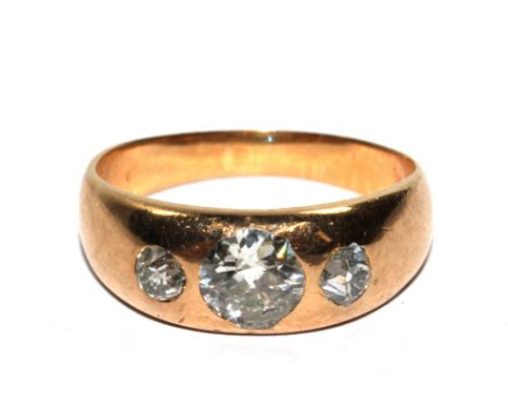 A three stone gold colour metal gypsy set ring 