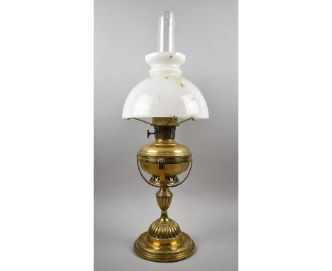 A Late 19th/Early 20th Century Brass Oil Lamp on Stand with Opaque Shade and Clear Glass Chimney, 72cm high Overall 
