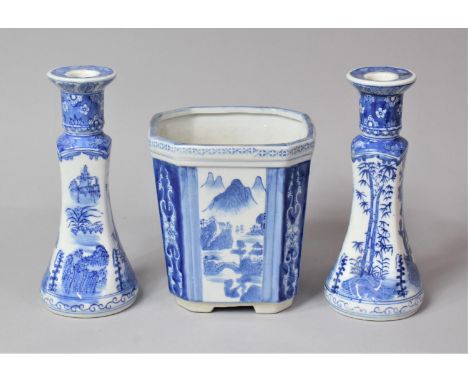 A Pair of Transfer Printed Oriental Style Blue and White Candlesticks and a Planter 