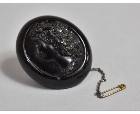A Late 19th/Early 20th Century Jet Brooch with Carved Maiden Portrait in Relief 