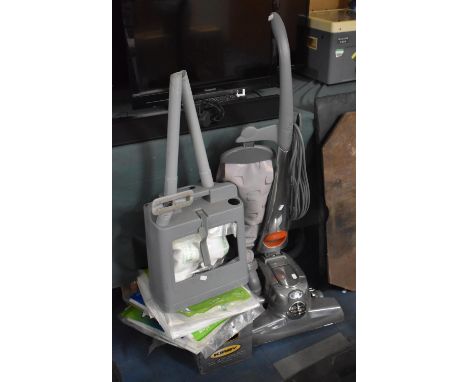 A Vintage Kirby Vacuum Cleaner with Bags and Accessories 