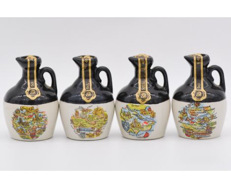 Twenty four assorted Rutherford's white ceramic decanters, blended Scotch whisky, county maps series on stoneware decanters, 