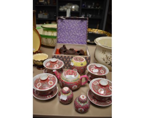 A cased Chinese Zisha tea set and similar Cantonese styled set