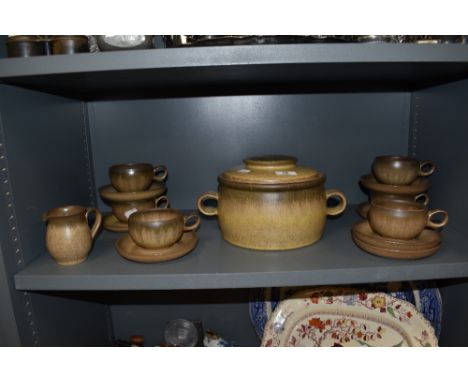 A set of six tea cups by Denby with milk jug and lidded crock pot