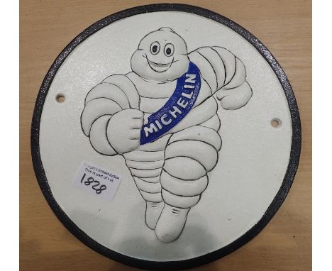 Cast iron Michelin Man running  sign, 40 x 7 cm. P&amp;P Group 2 (£18+VAT for the first lot and £3+VAT for subsequent lots) 