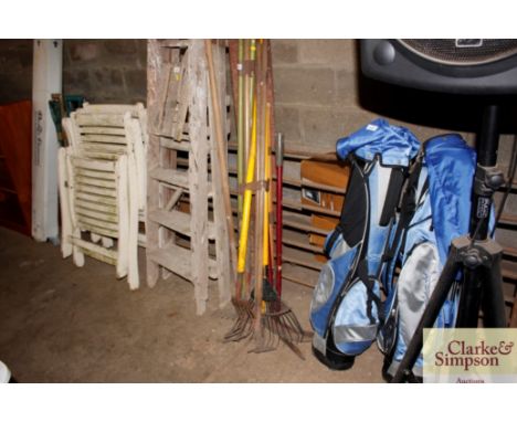 A quantity of long handled gardening tools 