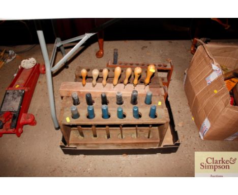 A box containing tool racks and some tools