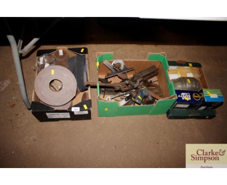 Three boxes containing various measuring tools; rolls of sandpaper; lights etc