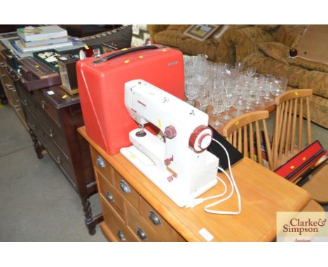 A Bernina electric sewing machine with fitted case - Sold as collector's item