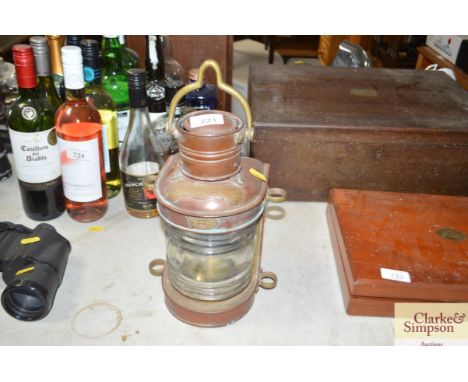 A copper and brass ships top light lamp