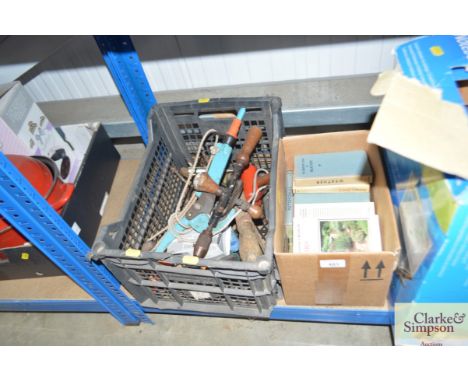 A USB notebook station; a quantity of observer books and a box of hand tools