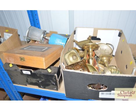 A box of fishing equipment and a gas lamp