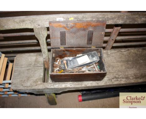 A box containing various hand tools and fittings