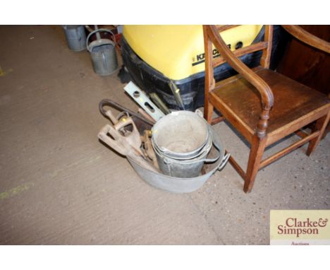 A twin handled galvanised bath; galvanised pales; various hand tools etc 