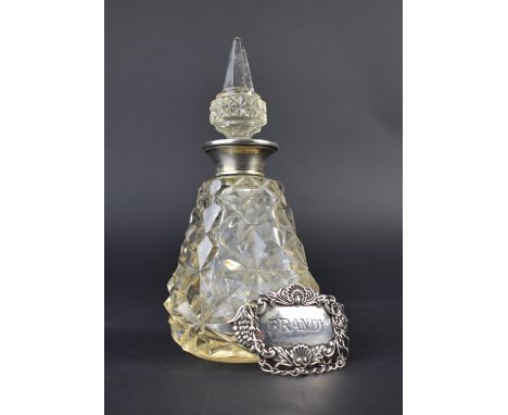 A Silver and Enamel Mounted Cut Glass Scent Bottle and Stopper, 16cm high Together with a Silver Decanter Label for Brandy