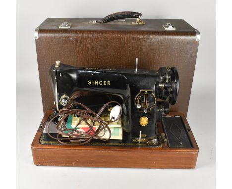 A Cased Singer Electric Sewing Machine