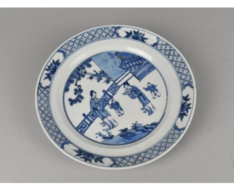 A Chinese Blue and White Plate Decorated with Mother and Children in Exterior Garden Setting, Four Character Mark for Kangxi 