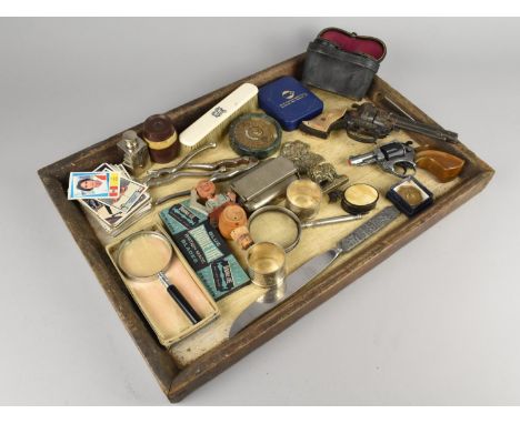 A Collection of Various Sundries top include Toy Pistols, 40 Year Calendar, Magnifying Glasses, Napkin Ring Etc