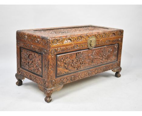 A Mid 20th Century Carved Oriental Camphor Wood Coffer with Hinged Lift Top and Four Claw Feet, 89cms Wide