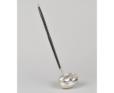 A Georgian Style Silver and Ebonised Wooden Twisted Handled Ladle, Sheffield 1979, 31cm high