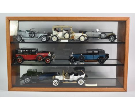 A Wooden Glazed Three Shelf Display Cabinet Containing Seven Model Die Cast Vintage Cars, 65cm Wide