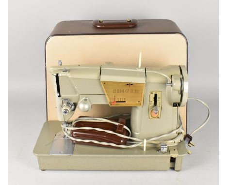 A 1960's Electric Singer Sewing Machine in Case