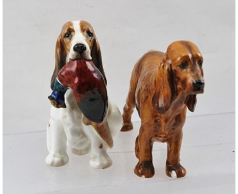 A ROYAL DOULTON CERAMIC SPANIEL, seated, having retrieved a pheasant, ref. HN1028, 13cm high, together with a standing SPANIE