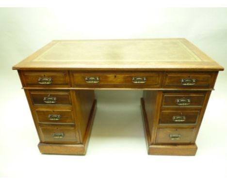 A LATE 19TH CENTURY MAHOGANY TWIN PEDESTAL DESK, having typical rectangular skiver insert top, over three inline drawers, sup