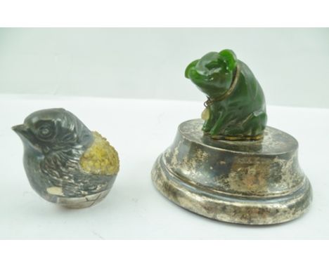 A SEATED MODEL PIG, a collar about his neck, mounted upon a silver plinth base, 5.5cm high, together with a white metal CHICK