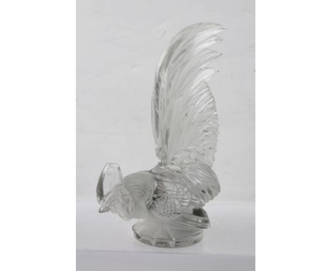 R. LALIQUE "Coq Nain" a rooster form glass car mascot, his tail up, his claws gripping the edge of the base, moulded "R. Lali
