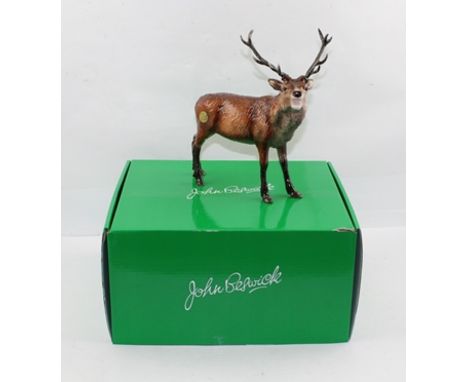 A BESWICK CERAMIC RED STAG, bears factory mark, 24cm high, in original box 