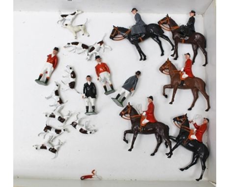 A BRITAINS CAST METAL HUNTING SET, five huntsman and their horses, four field attendants and ten hounds 