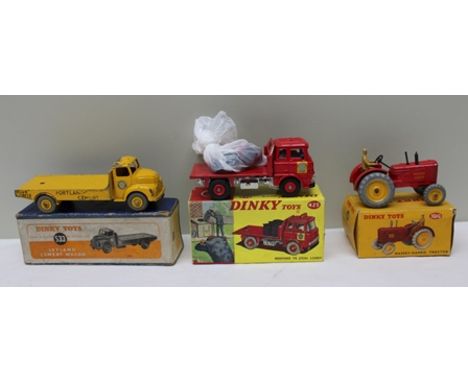 A DINKY TOYS NO.533 LEYLAND CEMENT WAGON, a Massey Harris tractor no.300 and a Dinky Toys Bedford TK coal lorry no.425 all bo