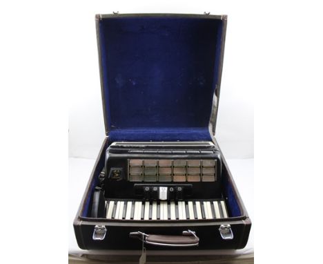 A "BAILE" PIANO ACCORDION, black and cream colour way, in original carrying case 