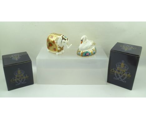 TWO ROYAL CROWN DERBY CERAMIC PAPERWEIGHTS, Elephant and Swan, with gilt buttons, each in original box 