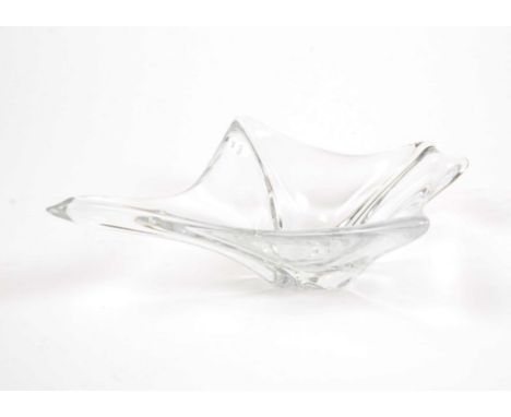 A Daum France crystal bowl, constructed of clear glass with elongated sides of organic form, base etched `Daum France`, 34 cm