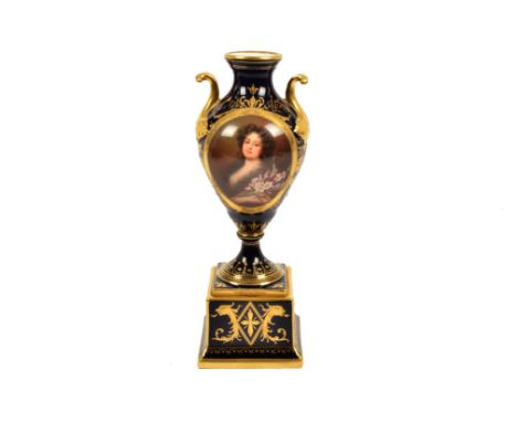 A Vienna porcelain twin-handled vase, on stepped square plinth base, decorated with oval portrait of a lady, on cobalt blue a