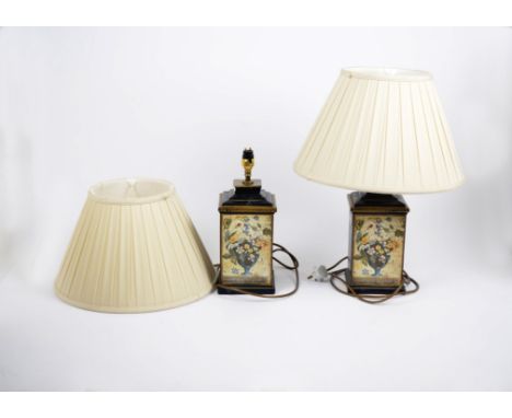 A pair of lamp bases, the metal bodies decorated with floral prints, the upper ceramic section painted in blue with gilt edge