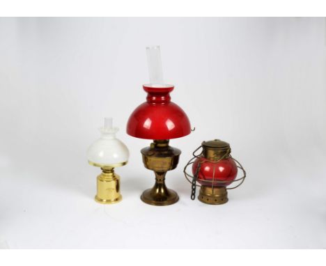 An E.S.S Sorensen Gilleleje Danmark 24923 oil table lamp, together with one other and three hanging examples with white and r