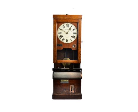 An early 20th Century oak cased 'clocking in' clock by Time Recorder Supply &amp; Maintenance Co.', glazed panel door reveali